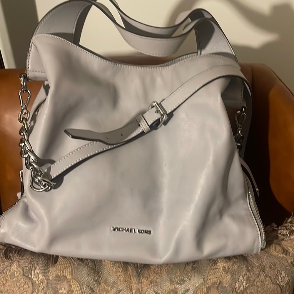 Cute Michael Kors purse for multiple purposes and very convenient to carry.